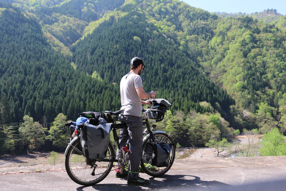 cycle touring in the Japanese Alps. Checking the map.
