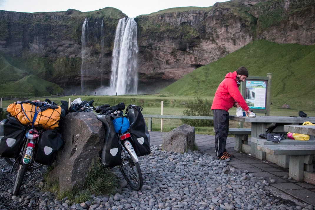 Preparing lunch in front of a waterfall | Crank & Cog cycle tour of Iceland.