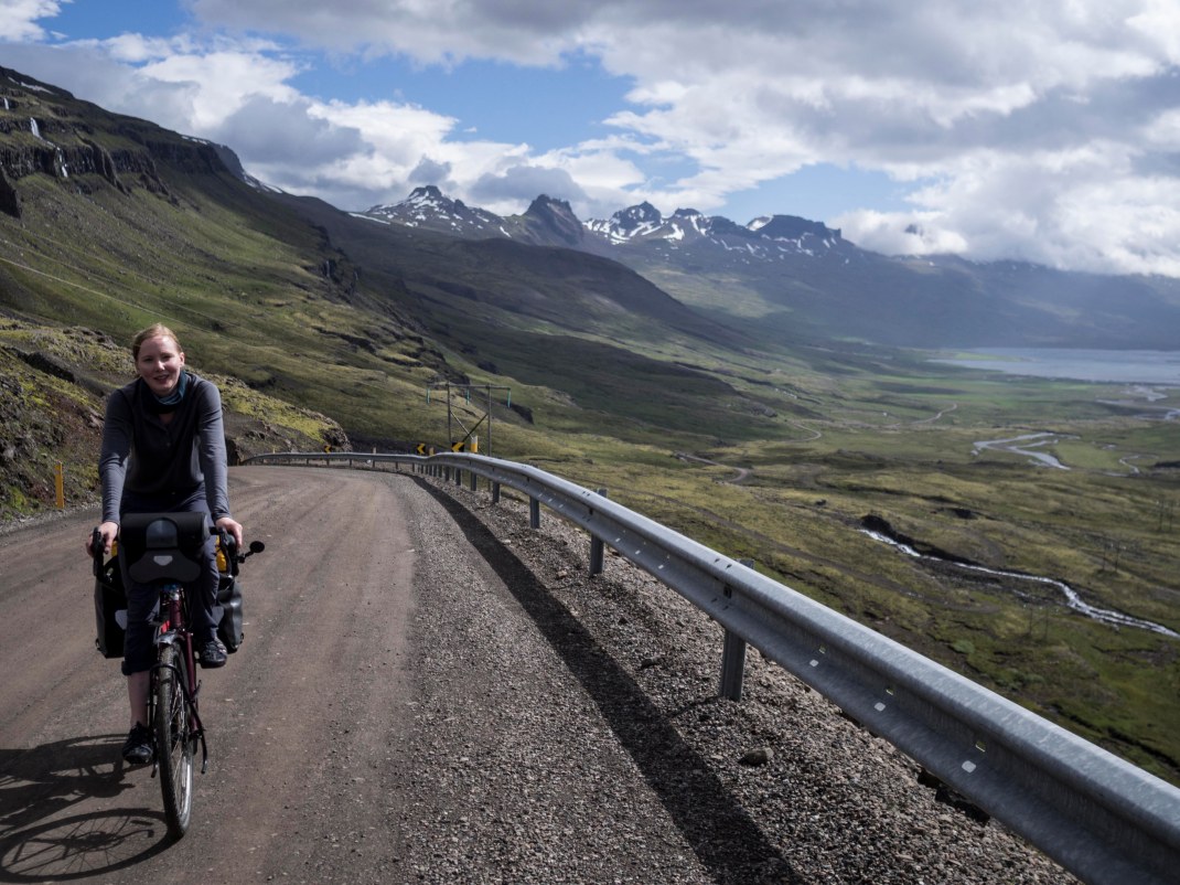 Laura cycling the Oxi mountain pass in eastern Iceland | Crank & Cog cycle tour of Iceland.